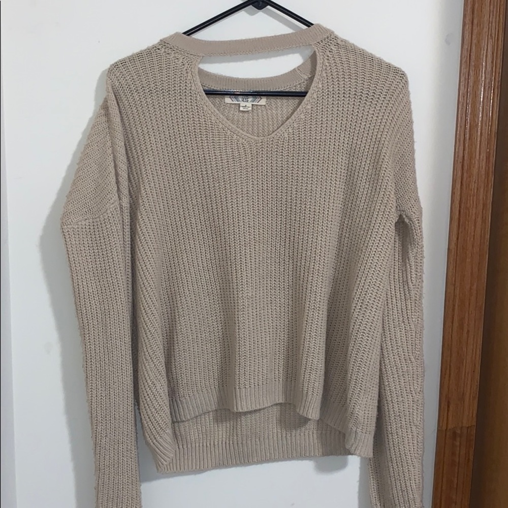 Pink Rose fall sweater with open neck area.